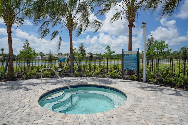 view of pool with a community hot tub