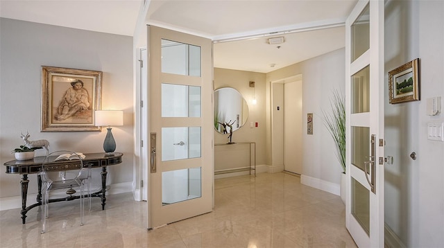 doorway to outside featuring french doors and elevator