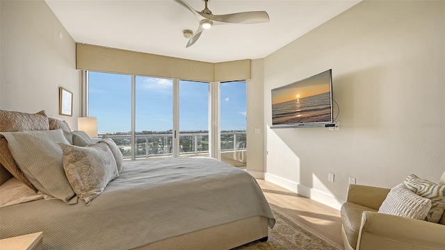 bedroom featuring ceiling fan and light hardwood / wood-style flooring