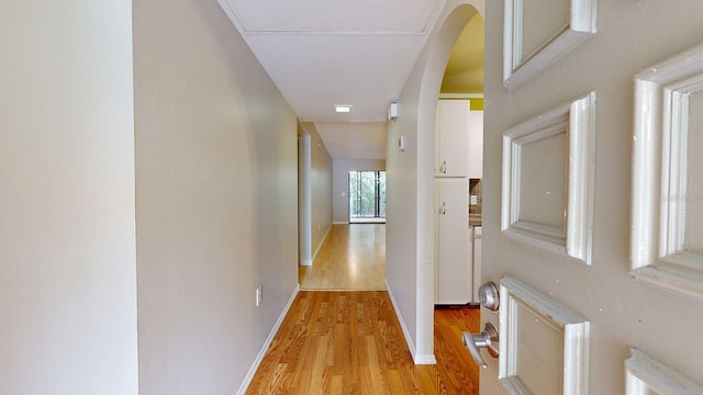 hall with light hardwood / wood-style floors