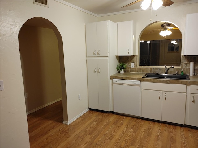 kitchen featuring decorative backsplash, dishwasher, light wood-type flooring, and ceiling fan