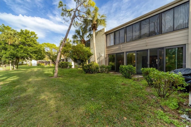 view of yard featuring a sunroom