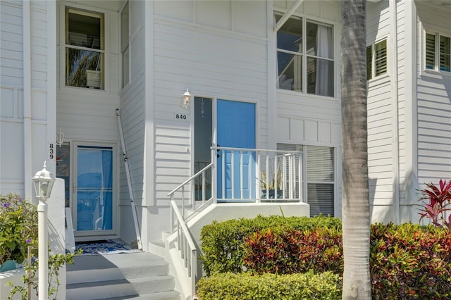 view of exterior entry with board and batten siding