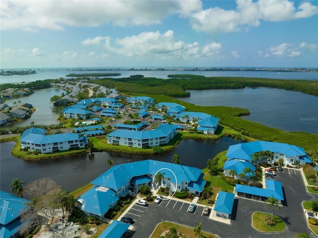 birds eye view of property with a water view