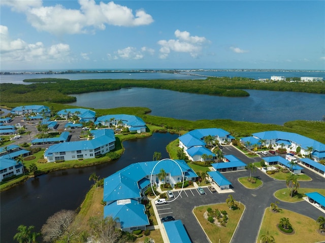 bird's eye view with a water view and a residential view