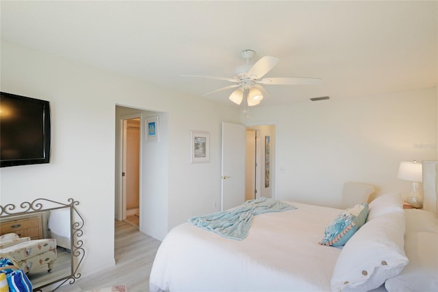 bedroom with ceiling fan and light hardwood / wood-style floors