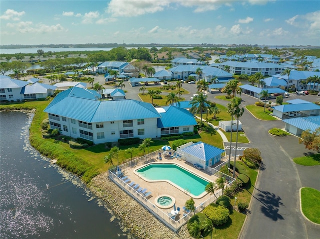 birds eye view of property featuring a water view