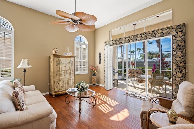 living room with hardwood / wood-style floors, ceiling fan, and a wealth of natural light