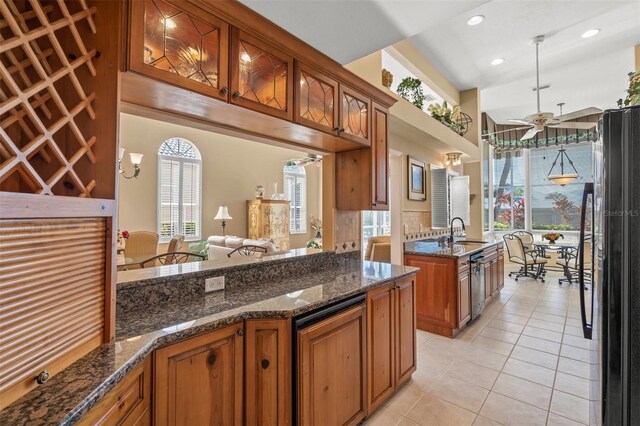 kitchen featuring ceiling fan, sink, a healthy amount of sunlight, and light tile patterned floors