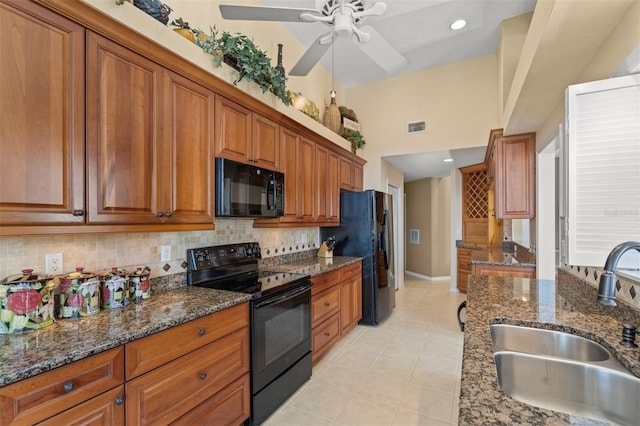 kitchen with light tile patterned floors, ceiling fan, sink, backsplash, and black appliances