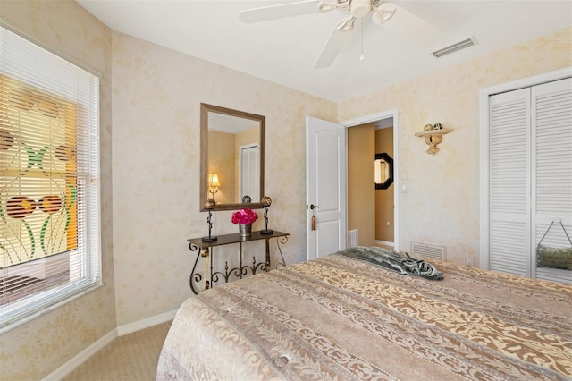 bedroom featuring carpet, a closet, and ceiling fan