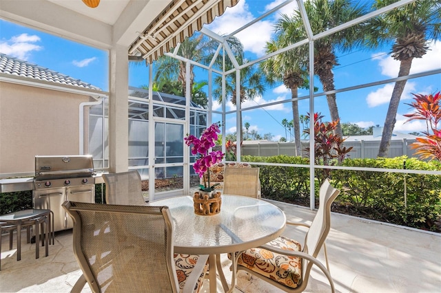 view of patio featuring a lanai and grilling area