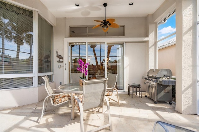 sunroom / solarium with ceiling fan