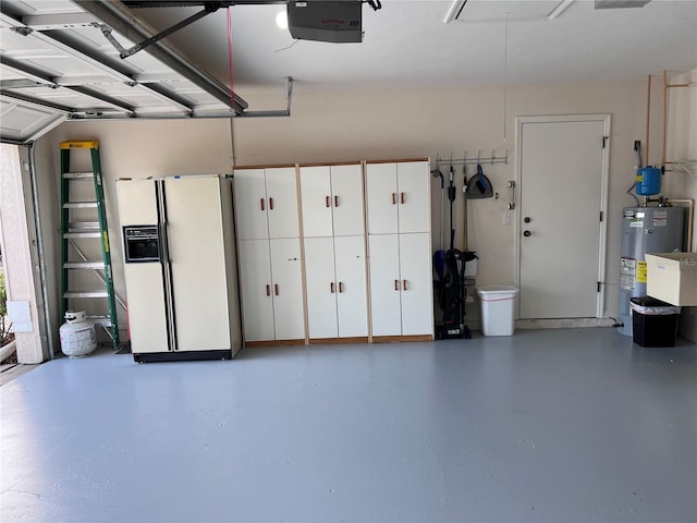 garage featuring electric water heater, a garage door opener, and white fridge with ice dispenser