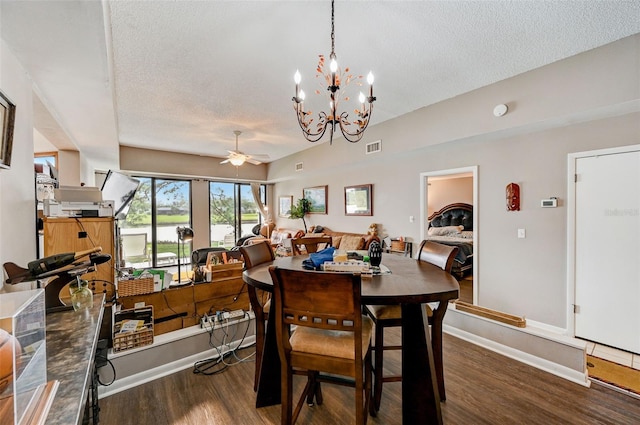 dining room with a textured ceiling, dark hardwood / wood-style floors, and ceiling fan with notable chandelier