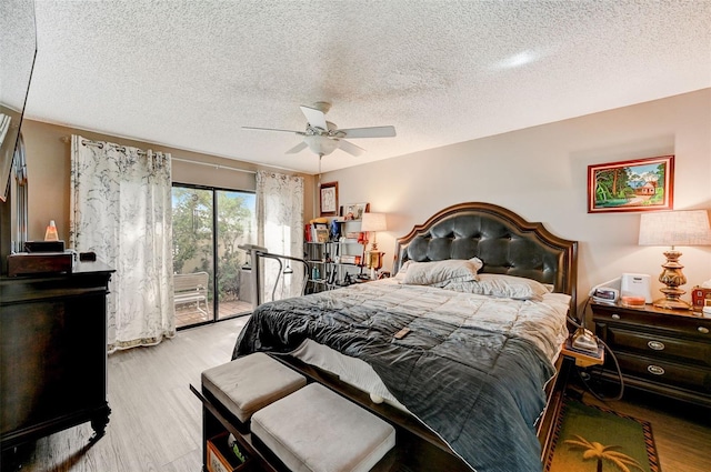 bedroom featuring a textured ceiling, access to exterior, ceiling fan, and light hardwood / wood-style flooring