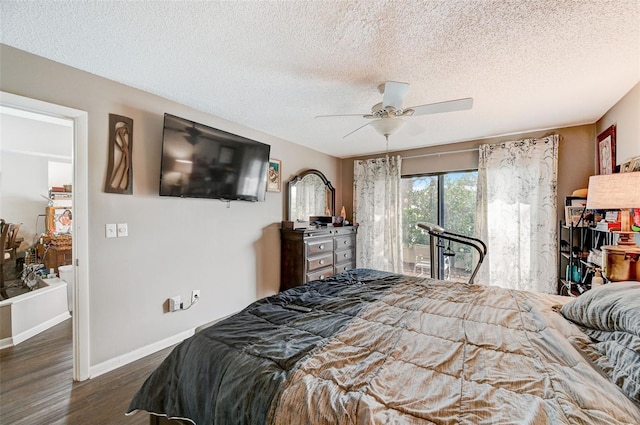 bedroom featuring ceiling fan, a textured ceiling, and dark wood-type flooring