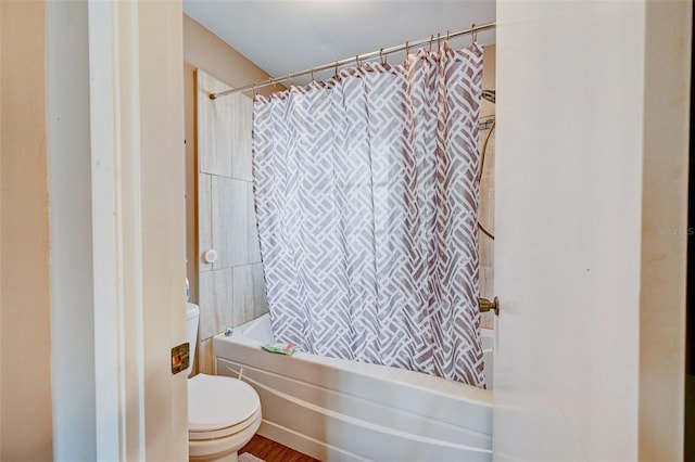 bathroom featuring toilet and shower / bathtub combination with curtain