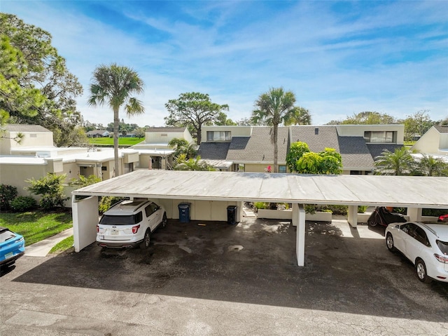 view of vehicle parking featuring a carport