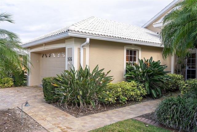 view of side of home with a garage