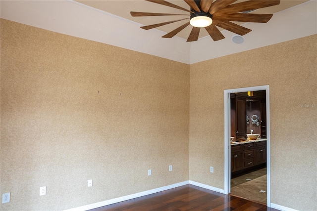 unfurnished room featuring dark hardwood / wood-style flooring and ceiling fan