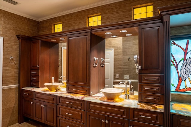 bathroom featuring vanity and ornamental molding