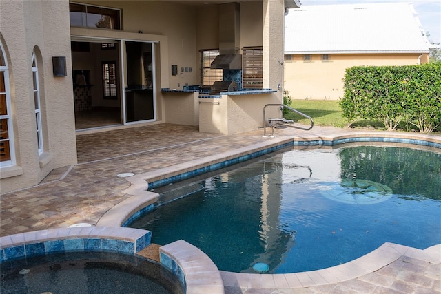 view of pool with area for grilling, grilling area, a patio, and an in ground hot tub