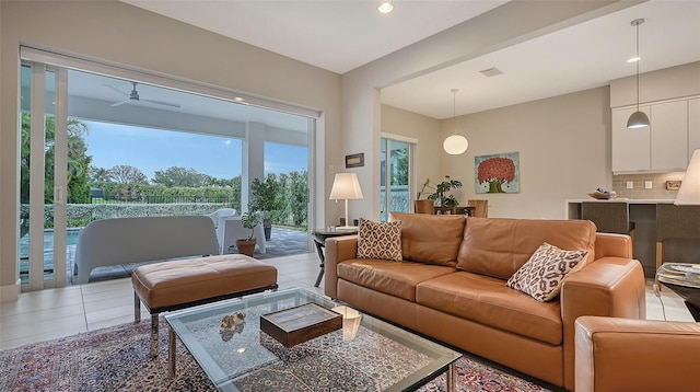 tiled living room featuring ceiling fan