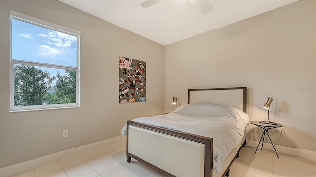 tiled bedroom with ceiling fan