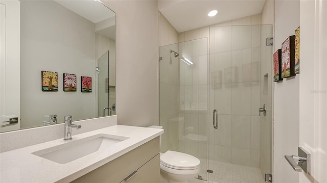 bathroom featuring walk in shower, vanity, vaulted ceiling, and toilet