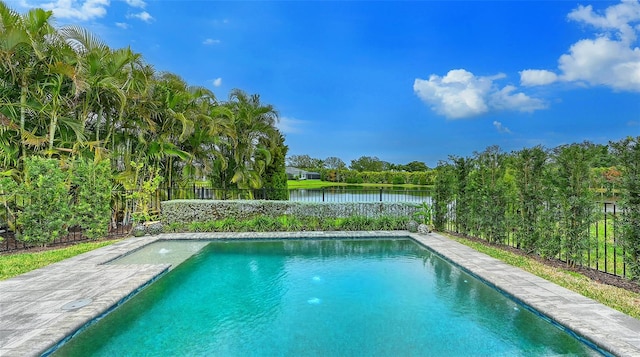 view of pool with a water view