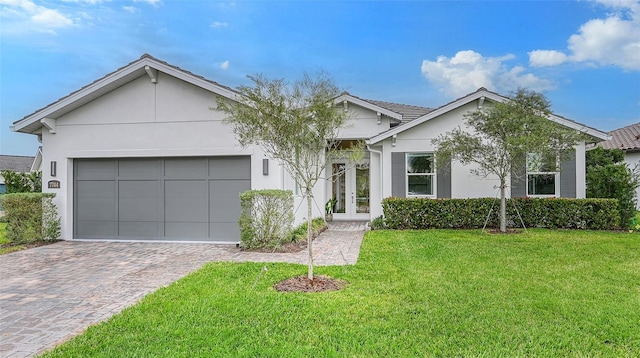 single story home with a front lawn and a garage