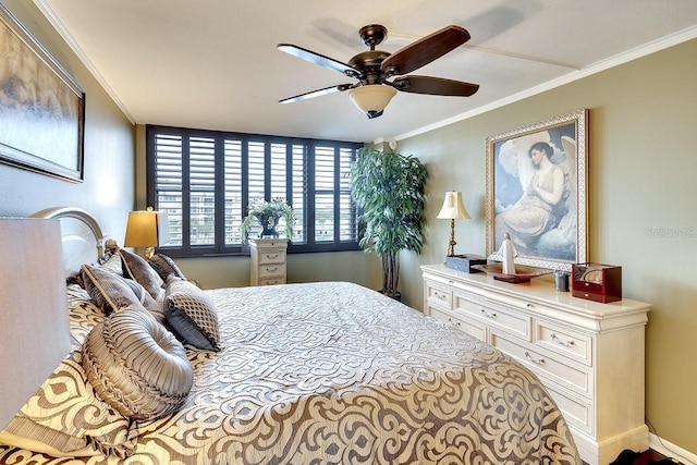 bedroom with ceiling fan and crown molding