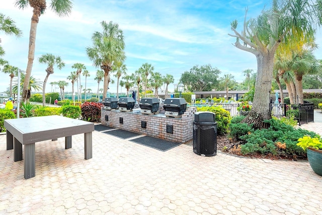 view of community featuring exterior kitchen