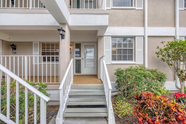 doorway to property featuring a balcony