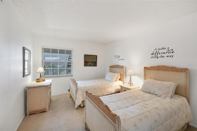 carpeted bedroom featuring a textured ceiling