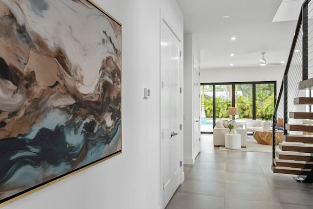 hallway with stairway and recessed lighting