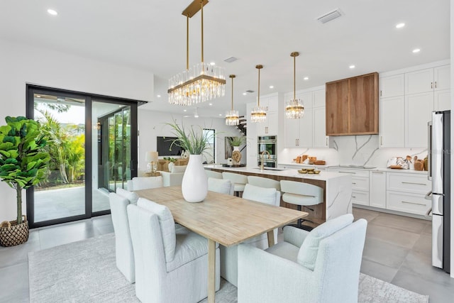 dining space with recessed lighting and visible vents