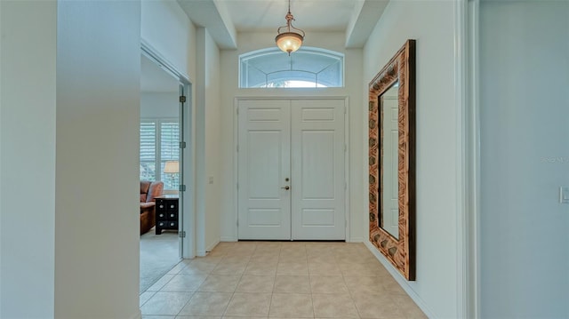 tiled entryway featuring plenty of natural light