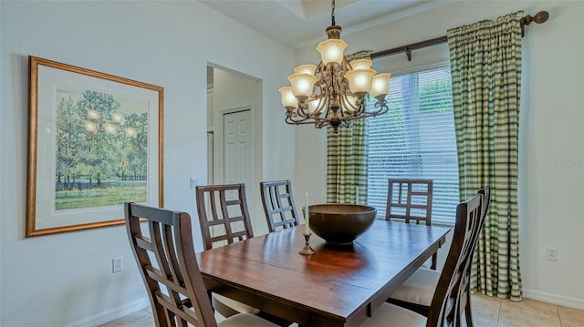 dining space with light tile patterned floors and a notable chandelier