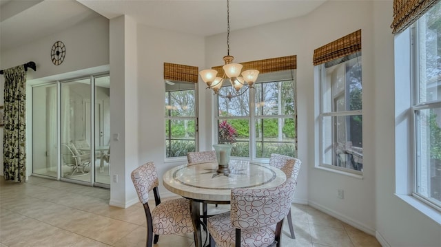 tiled dining space with an inviting chandelier