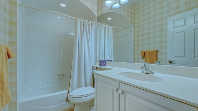 full bathroom featuring vanity, toilet, and shower / tub combo