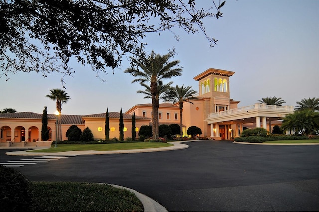 view of outdoor building at dusk