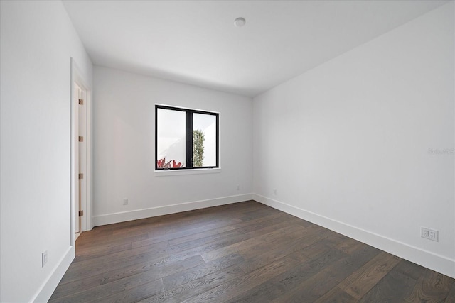 unfurnished room featuring dark hardwood / wood-style flooring