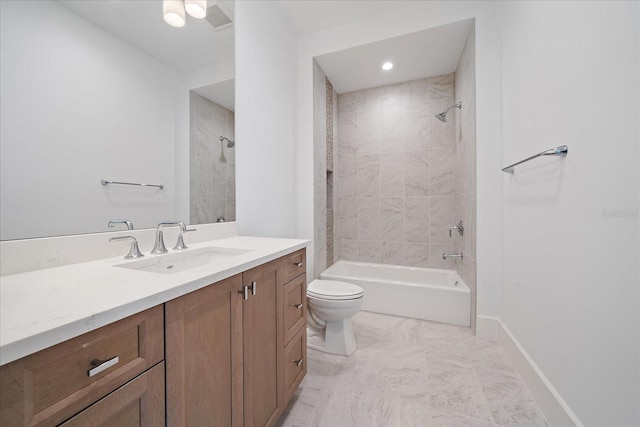 full bathroom with toilet, tiled shower / bath combo, and vanity