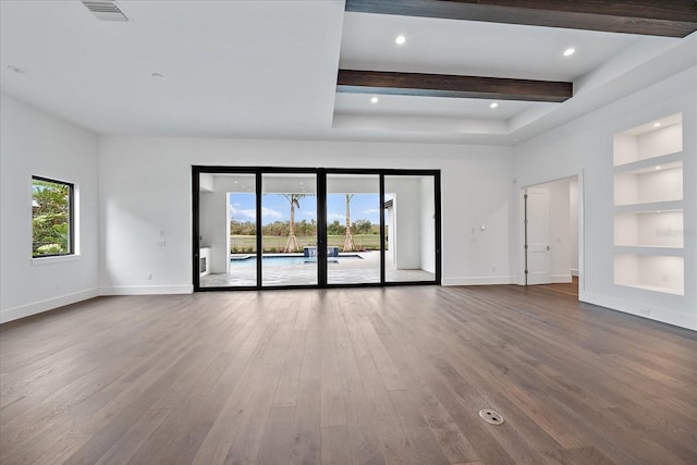 unfurnished living room featuring wood-type flooring and built in features