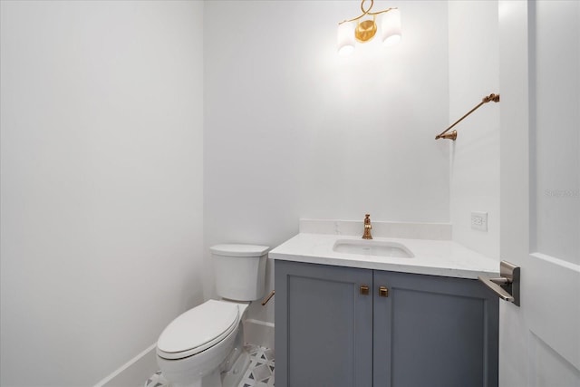 bathroom featuring toilet and vanity