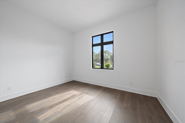 unfurnished room with wood-type flooring