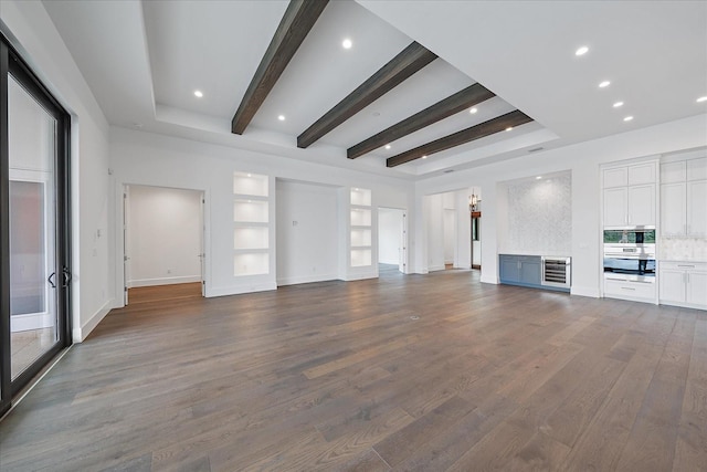 unfurnished living room featuring beam ceiling, french doors, heating unit, and wood-type flooring