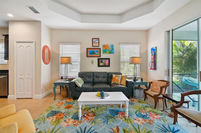 4618 Deep Creek Ter, Parrish, FL 34219 - living room featuring light tile flooring, plenty of natural light, and a raised ceiling
